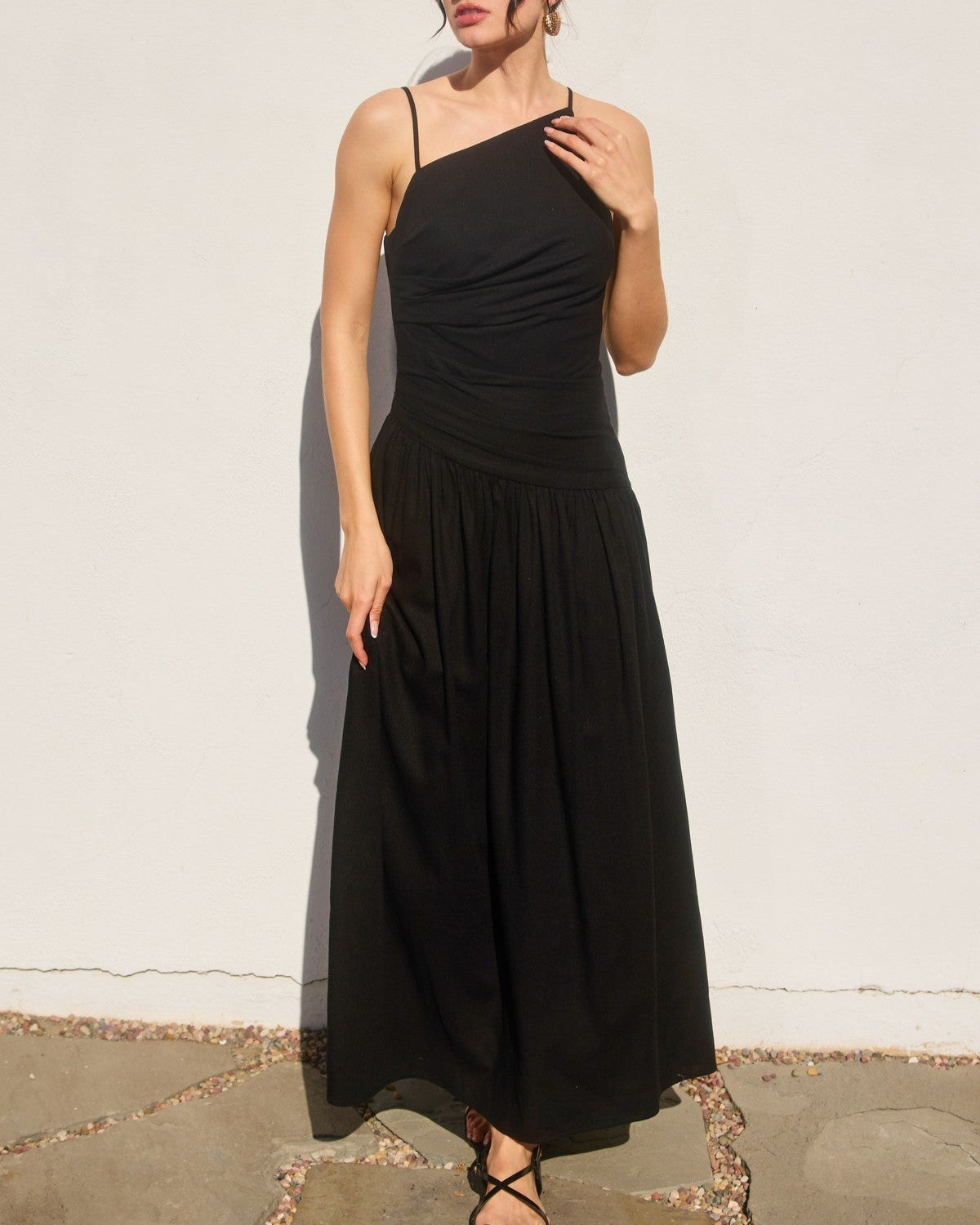black cotton linen maxi dress, asymmetrical neckline dress, strappy summer dress, drop waist dress, cotton dress with tortoise trim, black vacation dress, linen blend maxi dress, warm weather event outfit
